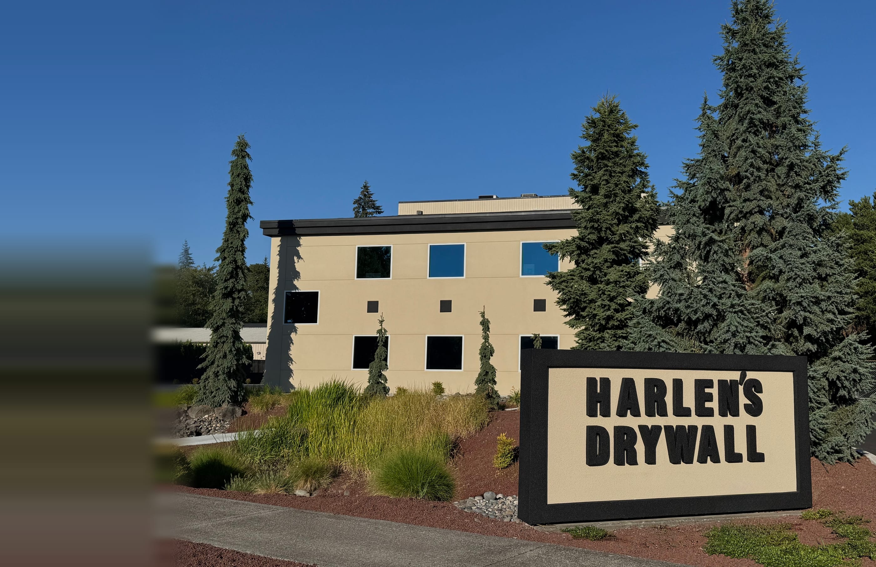 Harlen's Drywall Co. headquarters in Vancouver, Washington, with the company monument sign out front