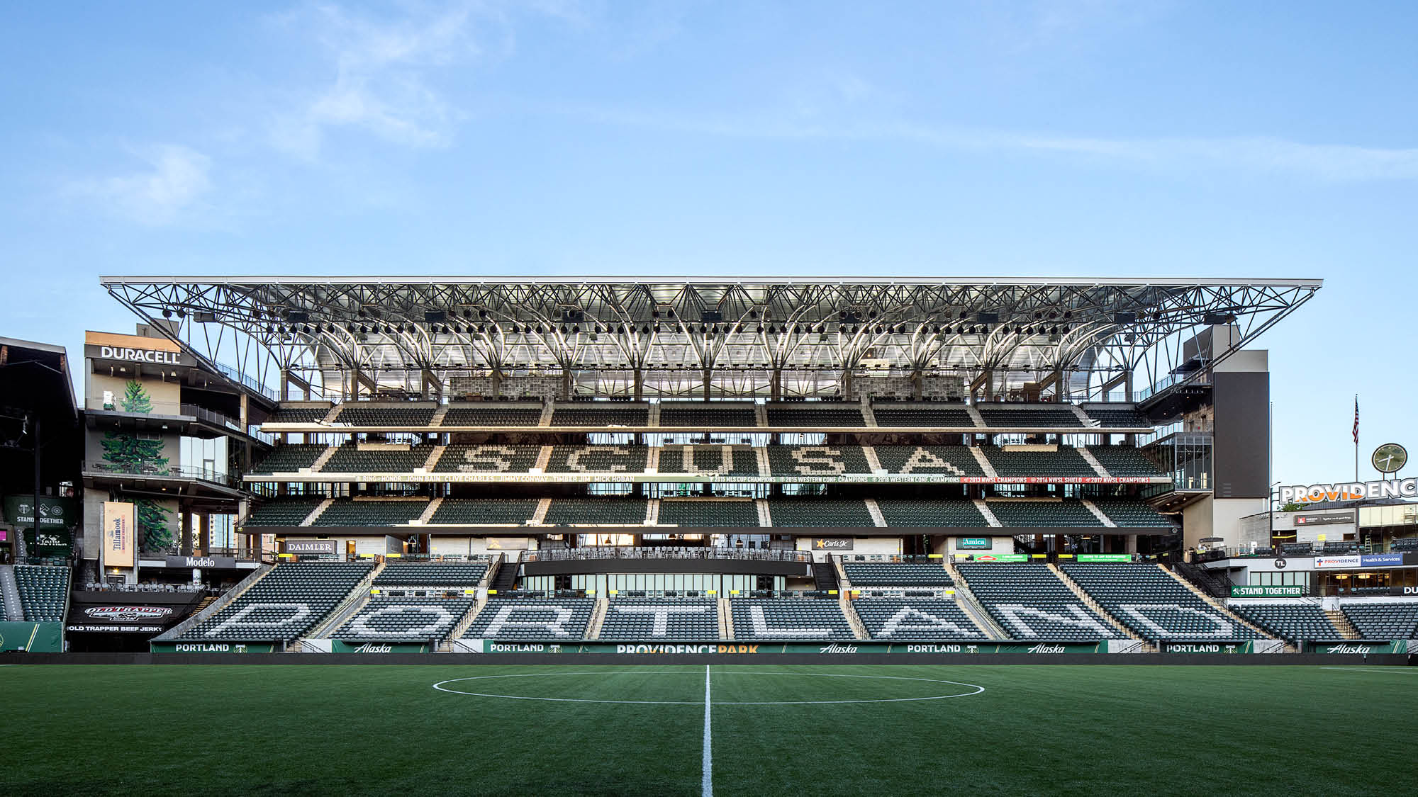 Providence Park stadium interior from the south goal, wood-truss canopy, Timbers branding on the stadium seats, Portland, Oregon